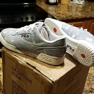 Light blue denim Fila sneakers.